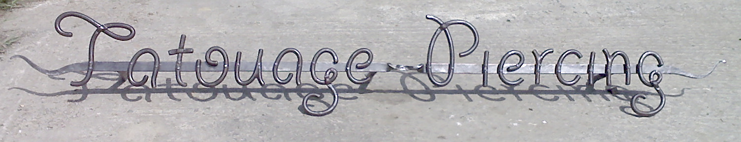 Enseigne Tatoueur
